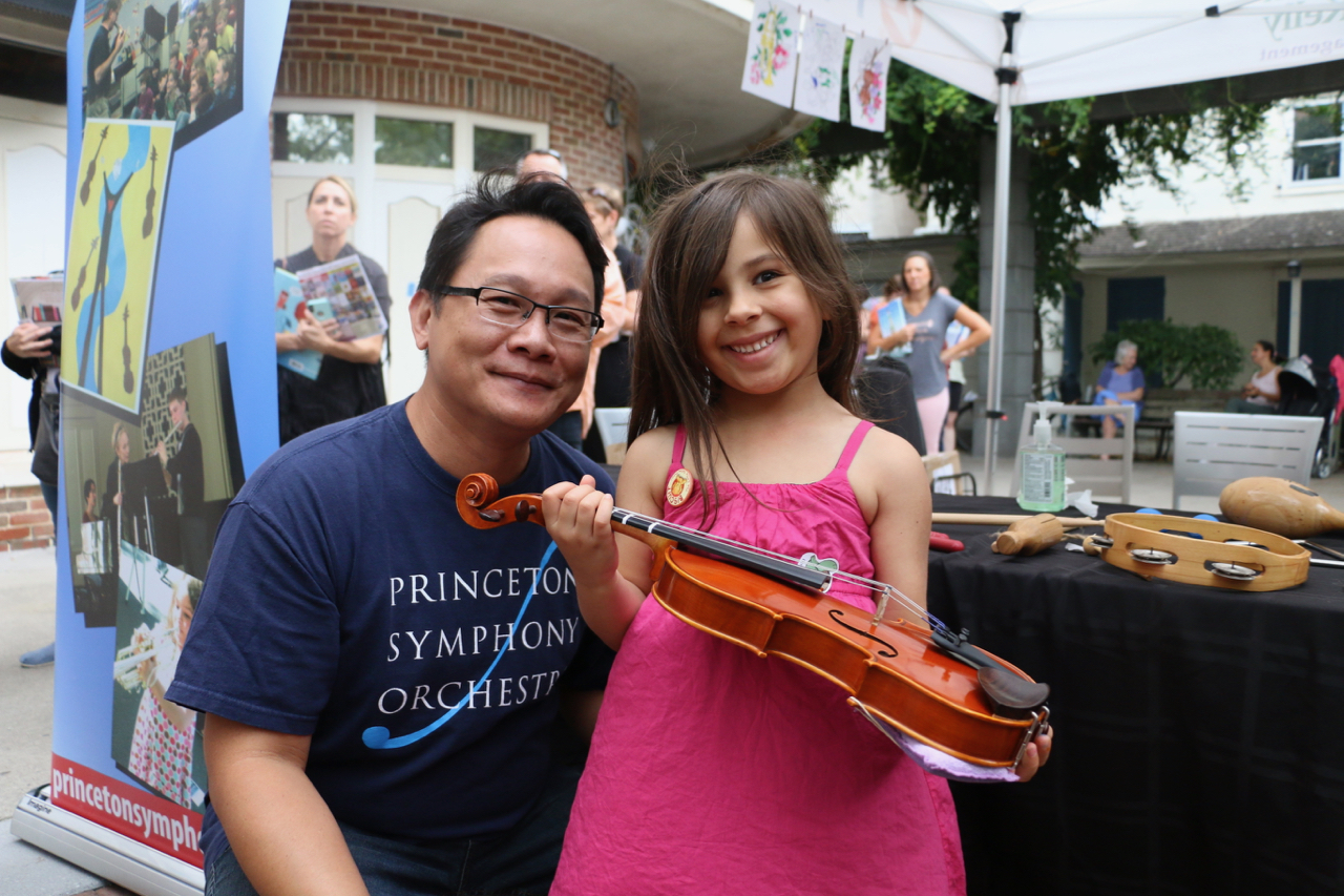 BRAVO Challenge Image of Musician with a Girl holding a violin