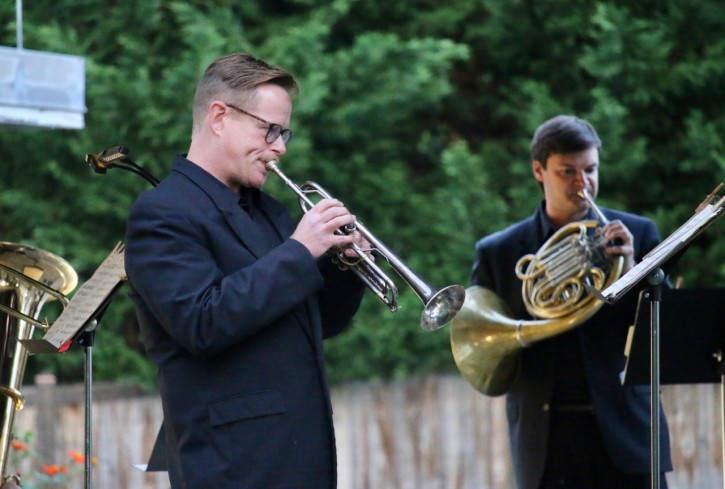 PSO Brass Quintet members Jerry Bryant and Jonathan Clark performing outside