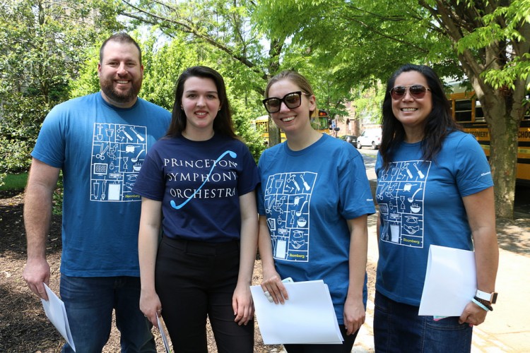 T-shirted volunteers awaiting school children coming to a PSO concert.