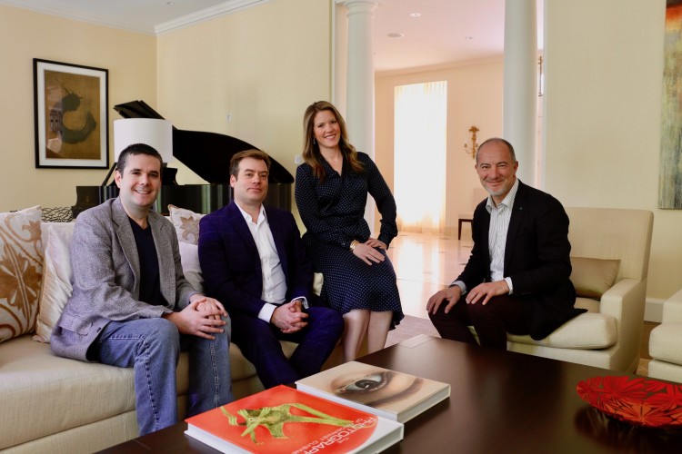 Princeton Festival Director Gregory Geehern, PSO Executive Director Marc Uys, PSO Board Chair Stephanie Wedeking, and Edward T. Cone Music Director Rossen Milanov seated on a sofa and chairs and smiling at the camera