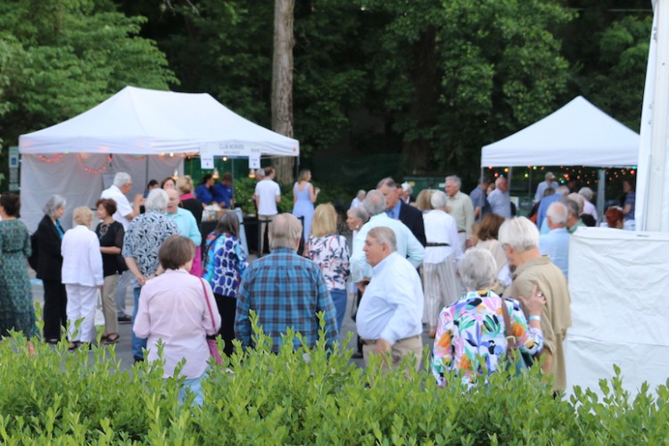 The Princeton Festival's outdoor lobby area with multiple patrons gathering.