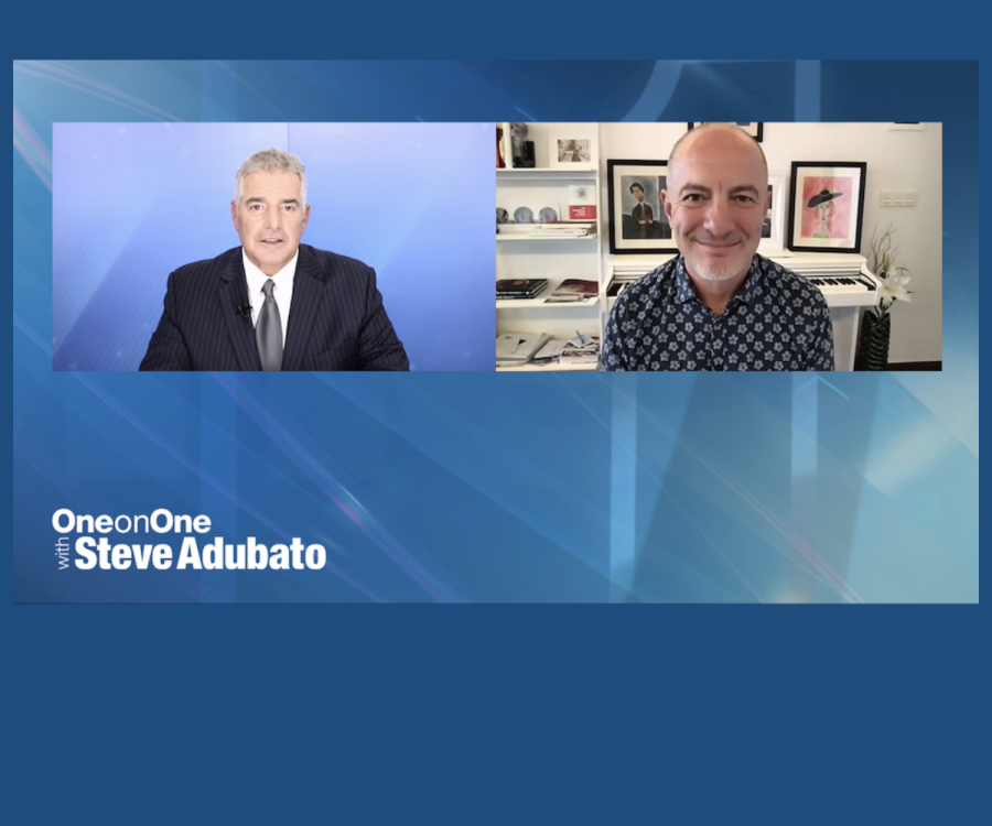 TV personality and guest in digital interview layout on a blue ground with text: "One-on-One with Steve Adubato"