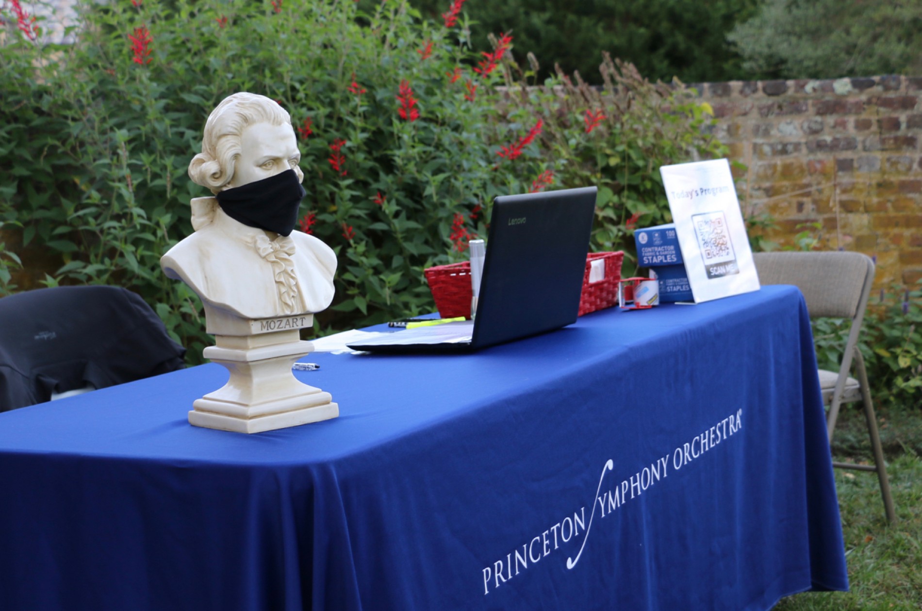 PSO check-in table with masked Mozart