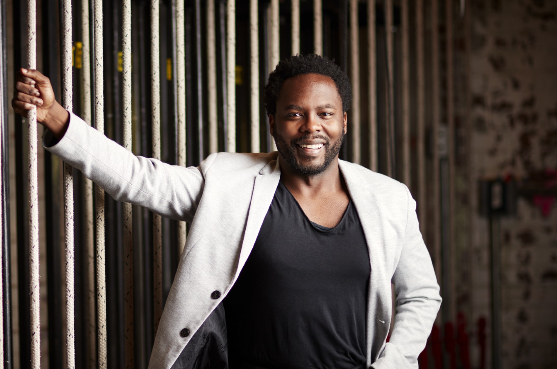 Will Liverman, baritone, wearing a white blazer over a black t-shirt