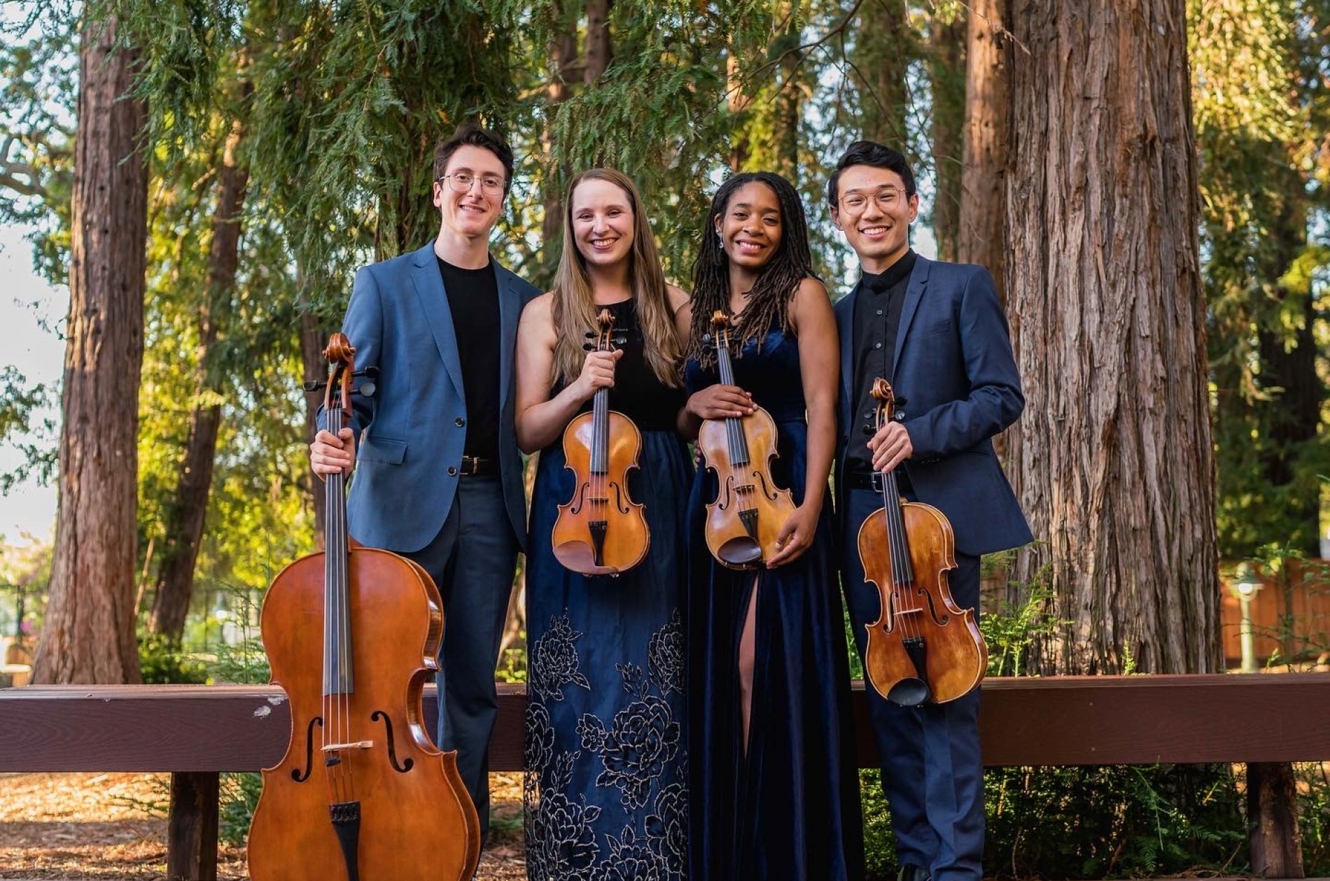 Abeo Quartet publicity image - a cellist, two violinists, and a violist.