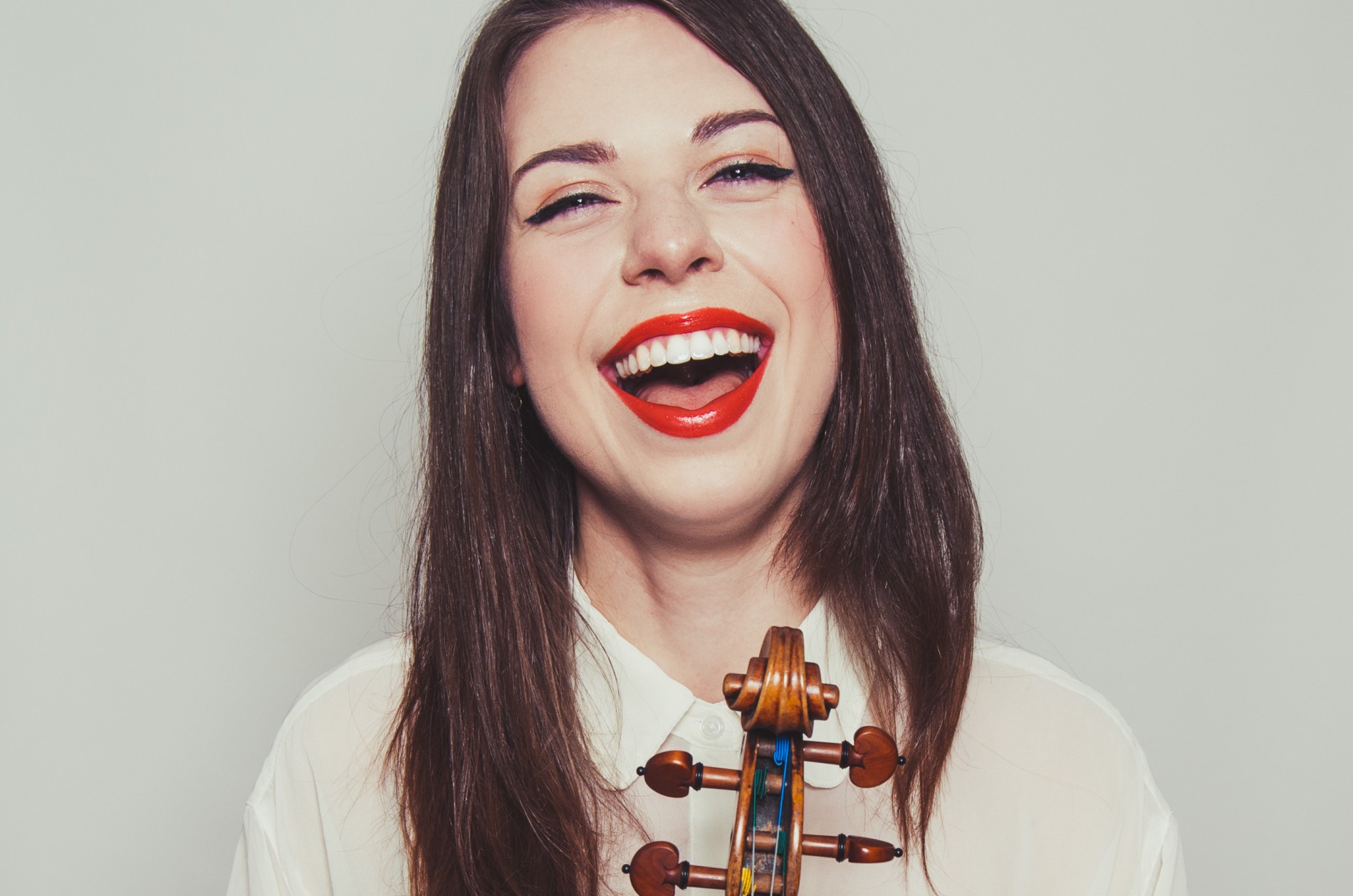 Tessa Lark, violin - laughing headshot
