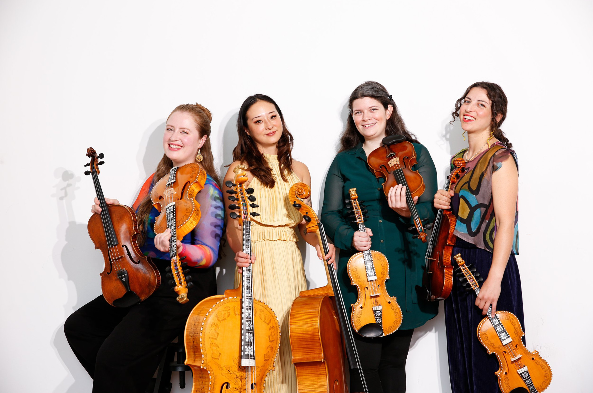 Bergamot Quartet holding Norwegian string instruments - publicity shot