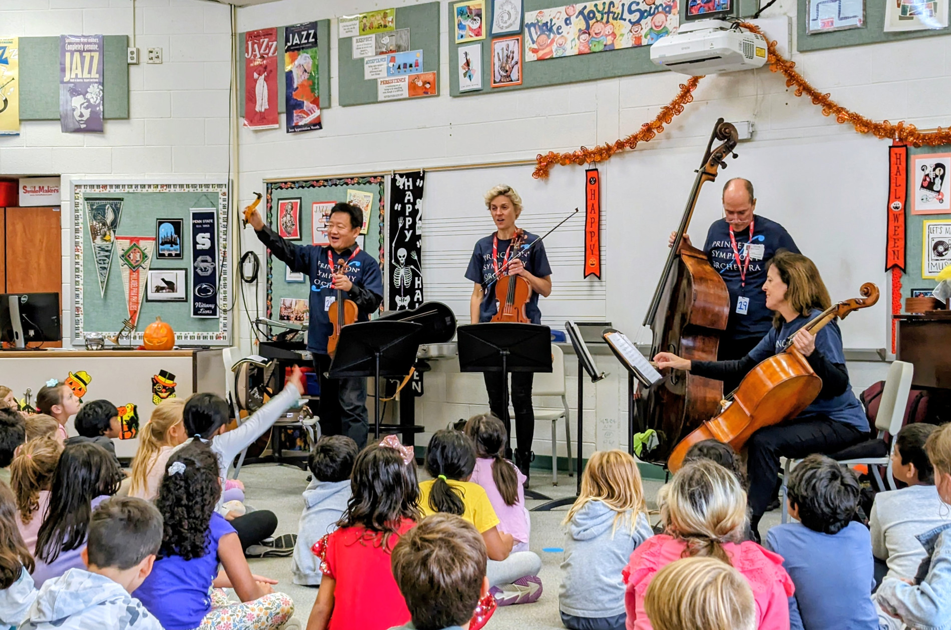 PSO strings playing for a group of second grade students